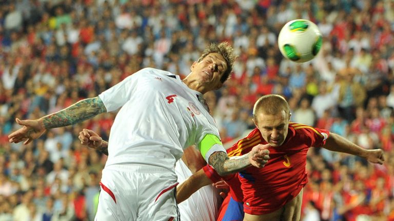 Armenia's national football team defender Varazdat Haroyan (R) vies with Denmark's national football team defender Daniel Agger  (L) during their FIFA 2014 World Cup Group B qualifying football match at the Hrazdan Stadium in the Armenia's capital Yerevan, on September 10, 2013. 