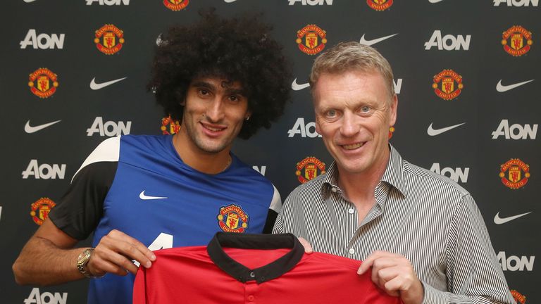 New Manchester United signing Marouane Fellaini and David Moyes at Aon Training Complex on September 2, 2013 in Manchester, England.