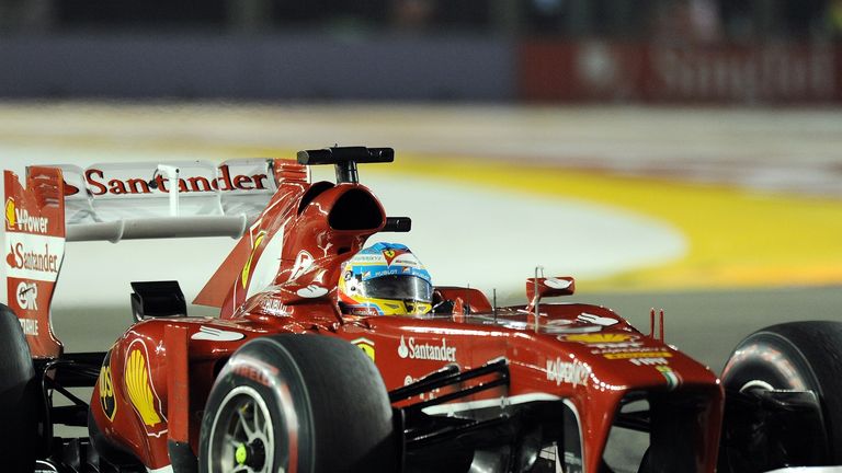 Fernando Alonso rounds turn three