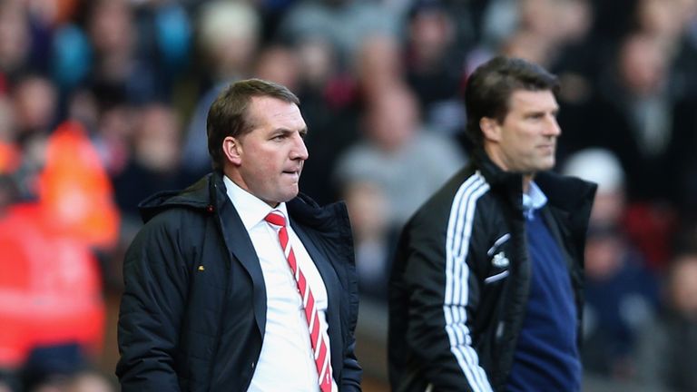 Liverpool manager Brendan Rodgers and Swansea manager Michael Laudrup  during the Barclays Premier League match between Liverpool and Swansea City at Anfield on February 17, 2013.