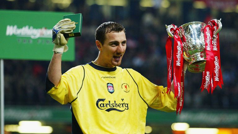 CARDIFF - MARCH 2:  Jerzy Dudek of Liverpool celebrates his man of the match performance by lifting the trophy up after the Worthington Cup Final between Liverpool and Manchester United held on March 2, 2003 at the Millennium Stadium, in Cardiff, Wales. Liverpool won the match and final 2-0. (Photo by Ben Radford/Getty Images)