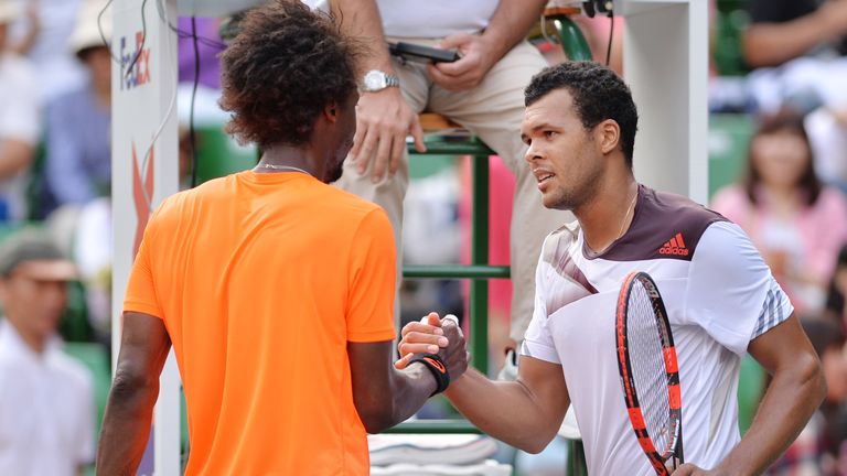 Jo-Wilfried Tsonga of France (R) shakes hands with Gael Monfils of France after the men's first round match between Jo-Wilfried Tsonga of France and Gael Monfils of France during day one of the Rakuten Open at Ariake Colosseum on September 30, 2013 in Tokyo, Japan.  