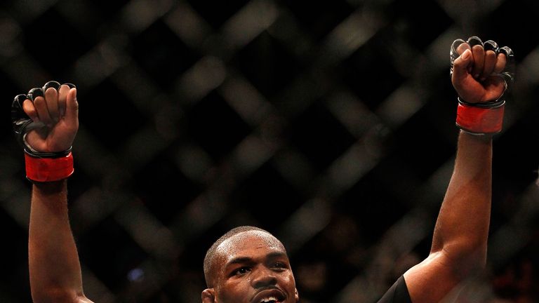 Jon Jones celebrates defeating Rashad Evans by unanimous decision in their light heavyweight title bout at UFC 145