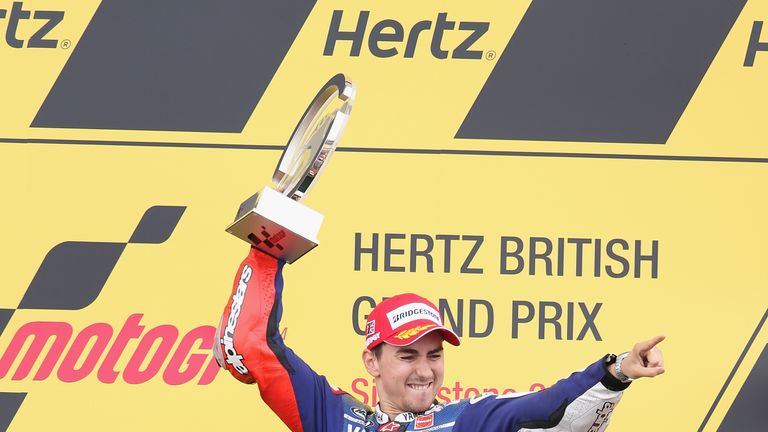 Jorge Lorenzo celebrates his race victory on the podium during the MotoGP of Great Britain at Silverstone