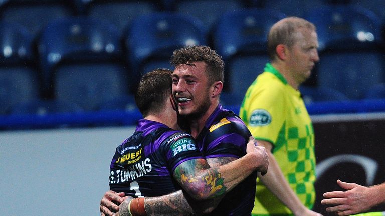 Wigan Warriors' Josh Charnley (right) celebrates with Sam Tomkins after scoring a try during the Super League qualifying play-off at the John Smith's Stadium.