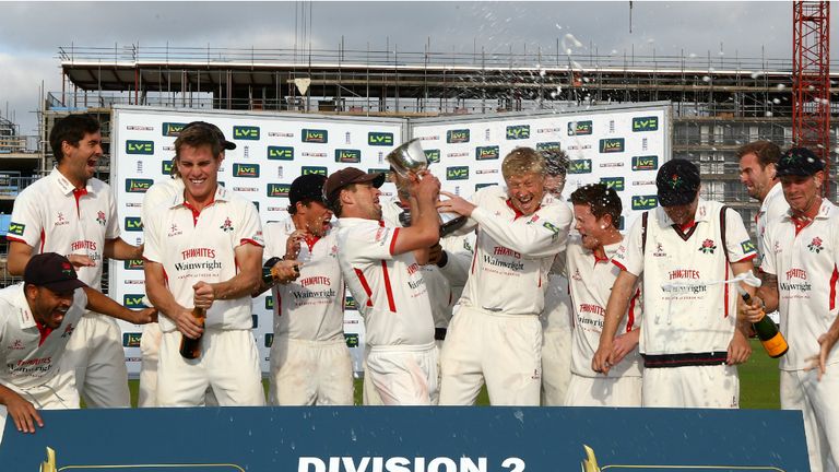 Crowned: Lancashire celebrate after securing promotion with a game to spare