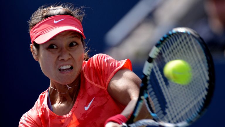 Li Na of China returns a shot to Ekaterina Makarova of Russia during a 2013 US Open women's quarterfinal singles match at the USTA Billie Jean King National Tennis Center September 3, 2013 in New York.    AFP PHOTO/Stan HONDA        (Photo credit should read STAN HONDA/AFP/Getty Images)