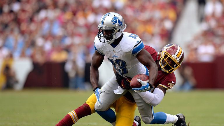 Nate Burleson of the Detroit Lions is tackled by David Amerson of the Washington Redskins