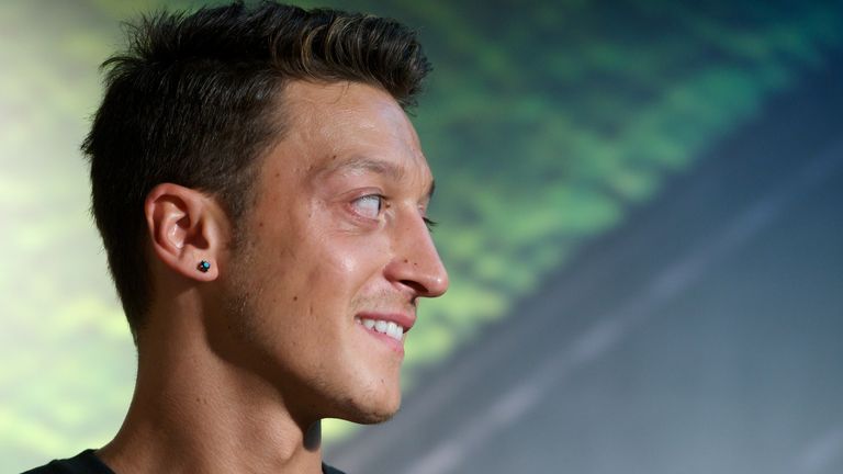 MADRID, SPAIN - AUGUST 28:  Real Madrid's German player Mesut Ozil is presented as the new face of Adidas at Estadio Santiago Bernabeu on August 28, 2013 in Madrid, Spain.  (Photo by Carlos Alvarez/Getty Images)