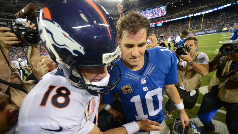 EAST RUTHERFORD, NJ - SEPTEMBER 15: Quarterback Peyton Manning #18 of the Denver Broncos and brother quarterback Eli Manning #10 of the New York Giants shake hands at the end of the Denver Broncos 41-23 win over the New York Giants at MetLife Stadium on September 15, 2013 in East Rutherford, New Jersey. (Photo by Ron Antonelli/Getty Images)