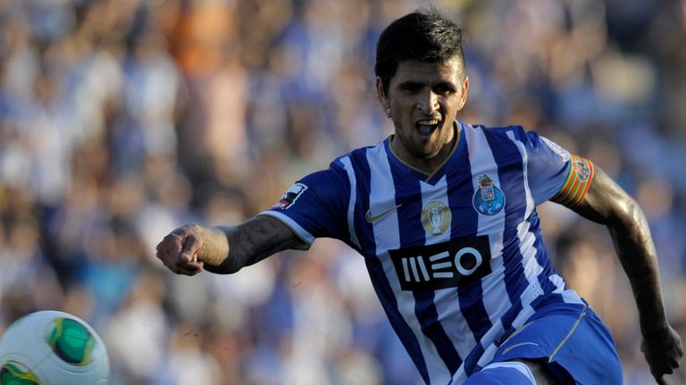 Porto's Argentinian midfielder Lucho Gonzalez kicks the ball during their Portuguese super league football match Pacos Ferreira vs FC Porto at the Machado Matos stadium in Felgueiras, on September 1, 2013. AFP PHOTO / MIGUEL RIOPA        (Photo credit should read MIGUEL RIOPA/AFP/Getty Images)