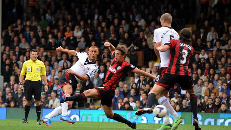 Fulham's Steve Sidwell Scores first goal as he's challenged by WBA'S Jonas Olsson during the Barclays Premier League match at Craven Cottage, London.