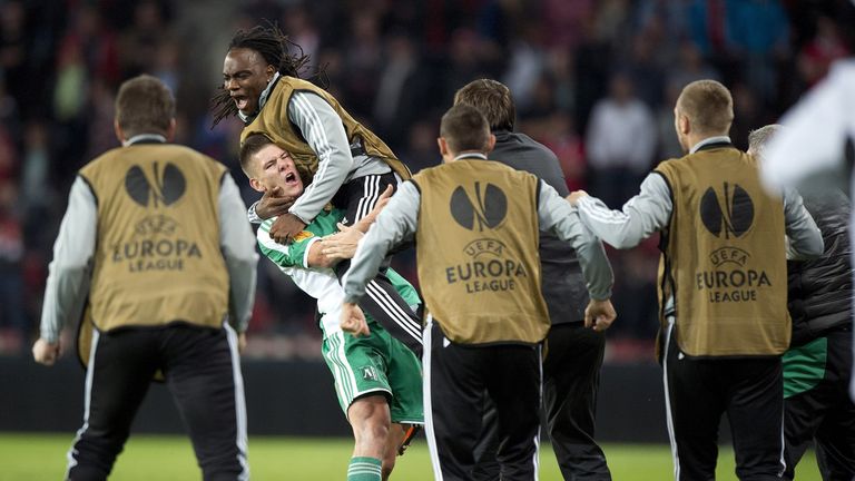 Roman Bezjak (2nd L) of PFK Ludogorets celebrates with his teammates after scoring during the UEFA Europa league football match PSV Eindhoven vs PFK Ludogorets in Eindhoven, on September 19, 2013.   AFP PHOTO / ANP / MARCEL VAN HOORN ***netherlands out ***        (Photo credit should read MARCEL VAN HOORN/AFP/Getty Images)