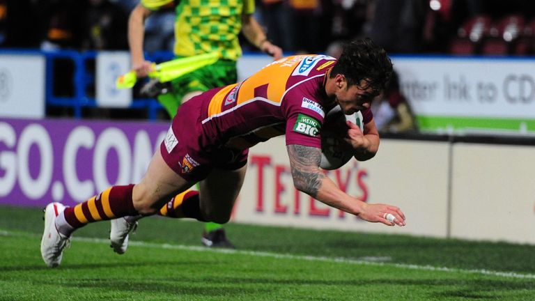 Huddersfield full-back Scott Grix dives over to score a try for the Giants during the Super League Preliminary Semi Final at the John Smiths Stadium