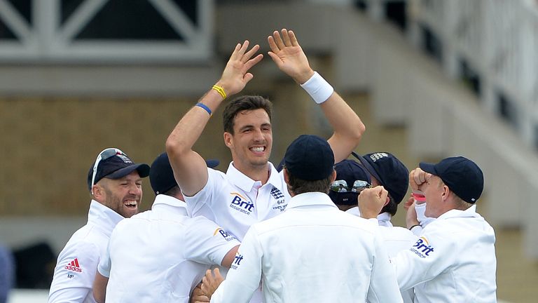 England's Steven Finn (C) celebrates after taking the wicket of Australia's Ed Cowan during the first Ashes cricket test match between England and Australia at Trent Bridge in Nottingham, central England on July 10