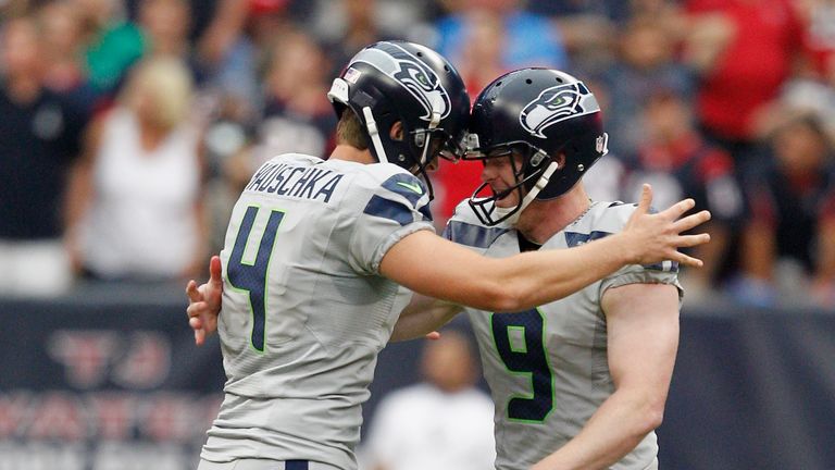 Steven Hauschka #4 of the Seattle Seahawks is congratulated by Jon Ryan #9 of the Seattle Seahawks after hitting a 45 yard field goal in overtime to beat the Houston Texans at Reliant Stadium on September 29, 2013 in Houston, Texas.  