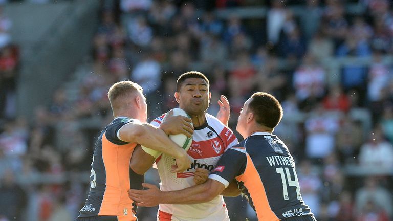 St Helens Willie Manu is tackled by Hull Kingston Rovers' Graeme Horne (left) and Lincoln Withers, during the Super League Elimination Play Off at Langtree Park