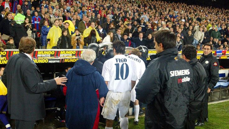  Luis Figo of Real Madrid leaves the pitch as play was suspended during the La Liga match between FC Barcelona and Real Madrid played at the Nou Camp 
