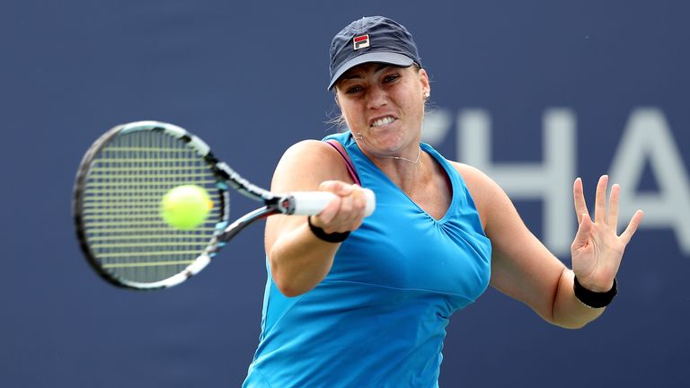 Alisa Kleybanova of Russia plays a forehand during her women's singles second round match against Jelena Jankovic of Serbia on Day Four of the 2013 US Open