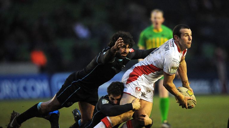 Anthony Laffranchi of St Helens passes the ball on as Chad Randell and Julien Rinaldi of Broncos come in to tackle him during the Stobart Super League match between London Broncos and St Helens at Twickenham Stoop on February 4, 2012 in London, England. 