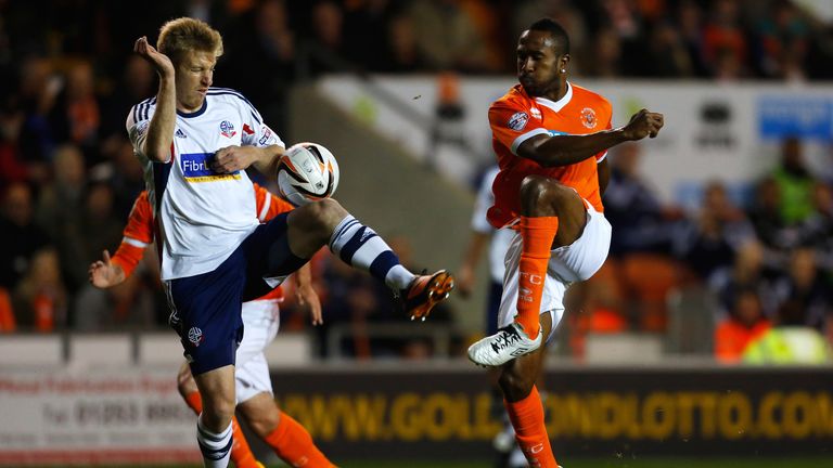 Ricardo Fuller (R) of Blackpool in action with Tim Ream of Bolton during the Sky Bet Championship match between Blackpool and Bolton Wanderers at Bloomfield Road