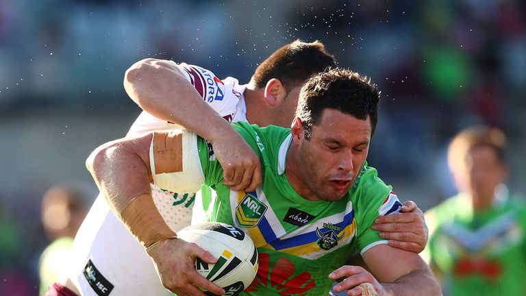 CANBERRA, AUSTRALIA - AUGUST 25: Brett White of the Raiders is tackled during the round 24 NRL match between the Canberra Raiders and the Manly Sea Eagles at Canberra Stadium on August 25, 2013 in Canberra, Australia.  (Photo by Mark Nolan/Getty Images)
