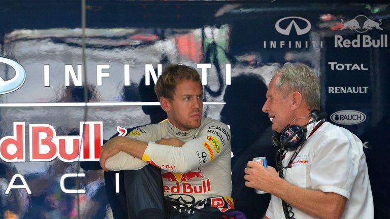 Sebastian Vettel chats with Dr Helmut Marko
