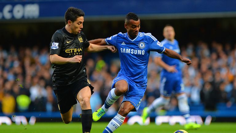 Ashley Cole of Chelsea and Samir Nasri of Manchester City battle for the ball during the Barclays Premier League match between Chelsea and Manchester City at Stamford Bridge on October 27, 2013 