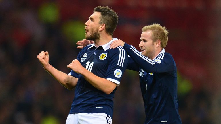 Scotland's Robert Snodgrass (left) celebrates scoring during the FIFA 2014 World Cup Qualifying, Group A match at Hampden Park, Glasgow.