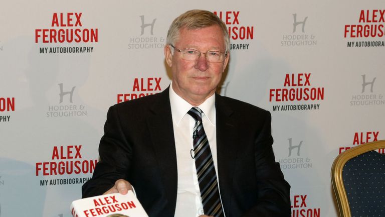 Sir Alex Ferguson with his Autobiography during the photocall at the Institute of Directors, London.