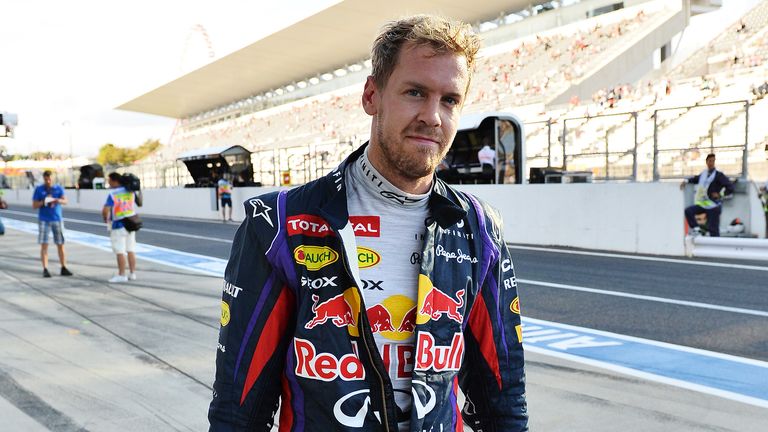 Sebastian Vettel tries to hide the smile after topping another session