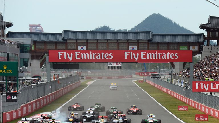 Sebastian Vettel leads into turn one