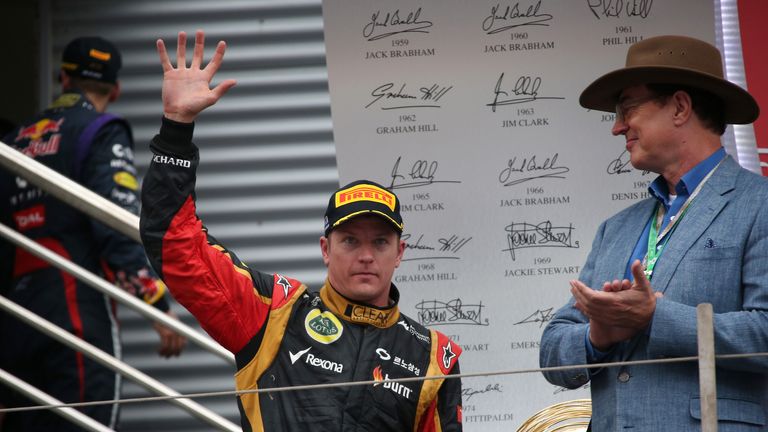 Kimi Raikkonen waves to the crowd