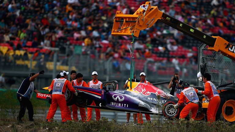 Mark Webber's car is lifted away