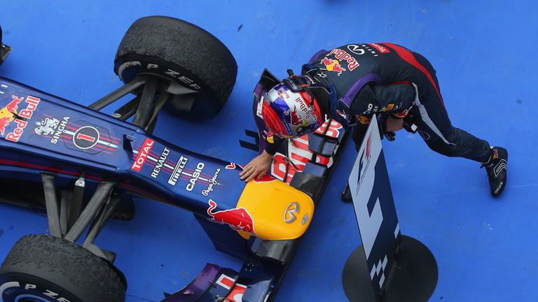 Sebastian Vettel rubs his race winning car