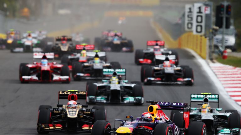 Romain Grosjean passes Lewis Hamilton into turn three