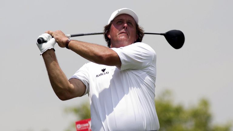 Phil Mickelson plays a tee shot on the 2nd hole during round two of the CIMB Classic at Kuala Lumpur Golf & Country Club