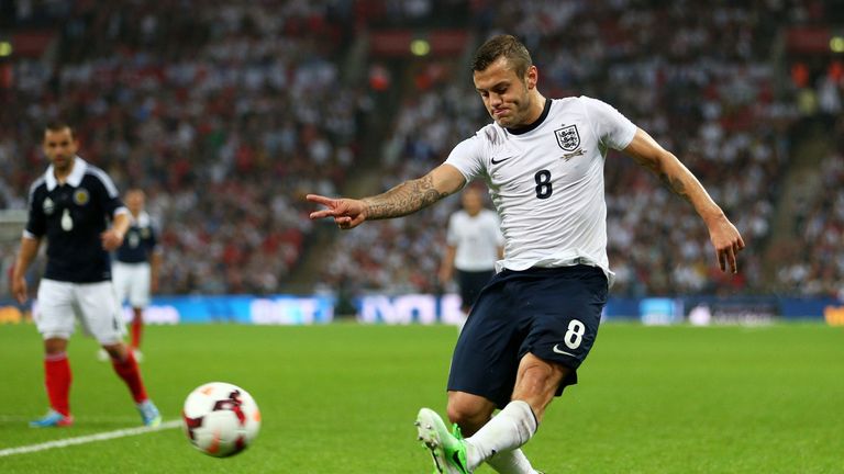 Jack Wilshere of England crosses the ball during the International Friendly match between England and Scotland at Wembley Stadium on August 14, 2013