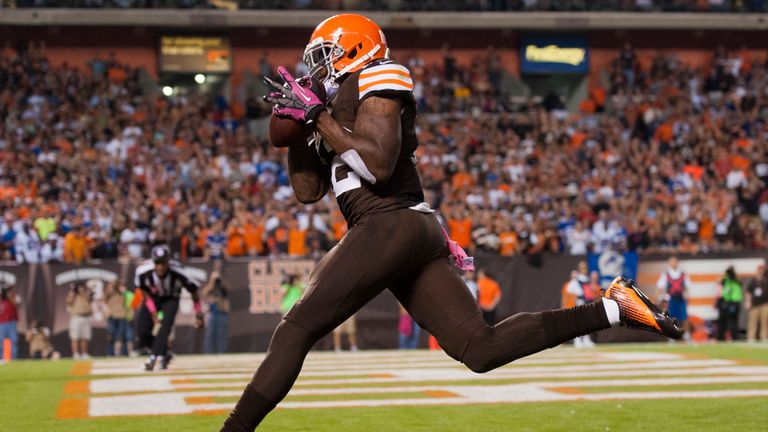 Wide receiver Josh Gordon #12 of the Cleveland Browns catches a touchdown reception during the second half against the Buffalo Bills FirstEnergy Stadium on October 3, 2013 in Cleveland, Ohio. The Browns defeated the Bills 37-24. 