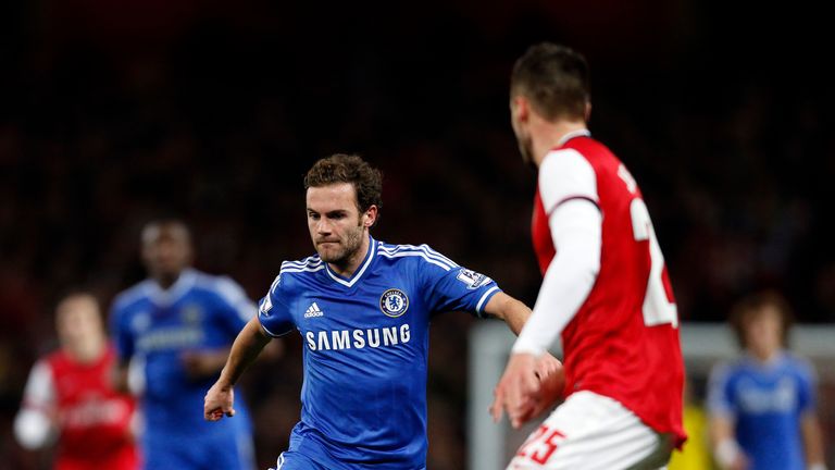 Chelsea's Spanish midfielder Juan Mata runs with the ball during the English League Cup fourth round football match between Arsenal and Chelsea at the Emirates Stadium in London on October 29, 2013. AFP PHOTO / ADRIAN DENNISnnRESTRICTED TO EDITORIAL USE. No use with unauthorized audio, video, data, fixture lists, club/league logos or live services. Online in-match use limited to 45 images, no video emulation. No use in betting, games or single club/league/player publications.        (Photo credit should read ADRIAN DENNIS/AFP/Getty Images)