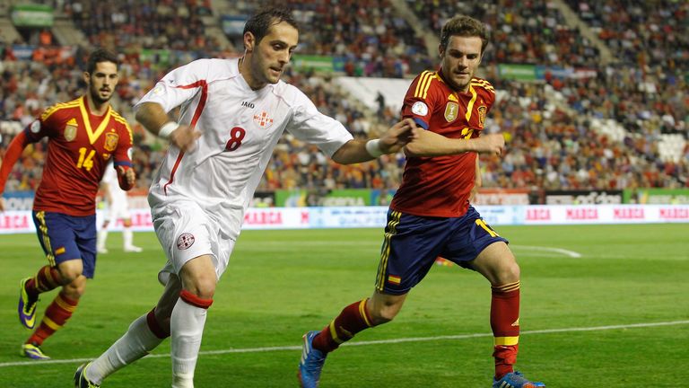 Georgia's midfielder Irakli Dzaria (L) vies with Spain's midfielder Juan Mata (R) during the World Cup 2014 qualifying football match Spain vs Georgia at the Carlos del Monte stadium in Albacete on October 15, 2013. Spain won the match 2-0.  AFP PHOTO / JOSE JORDAN        (Photo credit should read JOSE JORDAN/AFP/Getty Images)