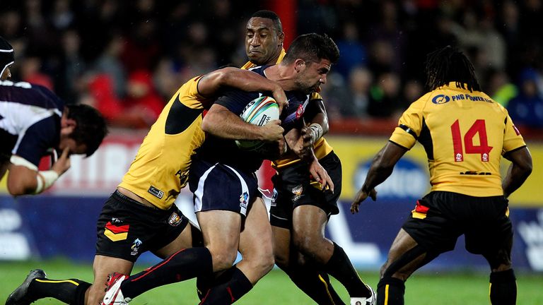 Mickael Simon of France is tackled during the Rugby World Cup Group B match between Papua New Guinea and France at Craven Park Stadium on October 27, 2013 in Hull, England.  (Photo by Ben Hoskins/Getty Images)