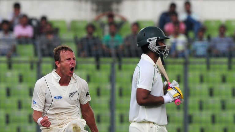 New Zealand cricketer Neil Wagner (L) celebrates the dismissal of Bangladesh batsman Tamim Iqbal (R) during the first day of the second cricket Test match between Bangladesh and New Zealand at the Sher-e Bangla National Stadium in Dhaka on October 21, 2013