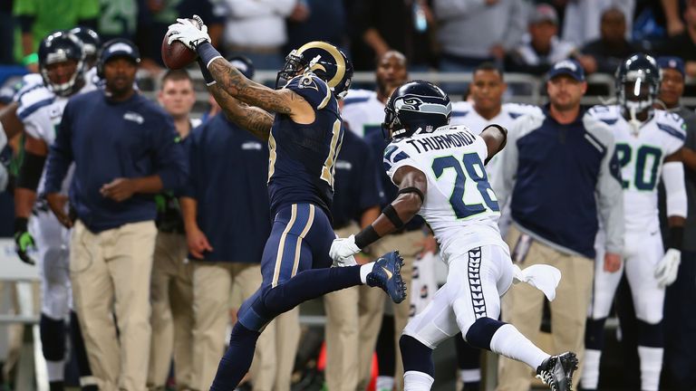 Austin Pettis #18 of the St. Louis Rams makes a catch against Walter Thurmond #28 of the Seattle Seahawks during an NFL game at Edward Jones Dome on October 28, 2013 in St Louis, Missouri