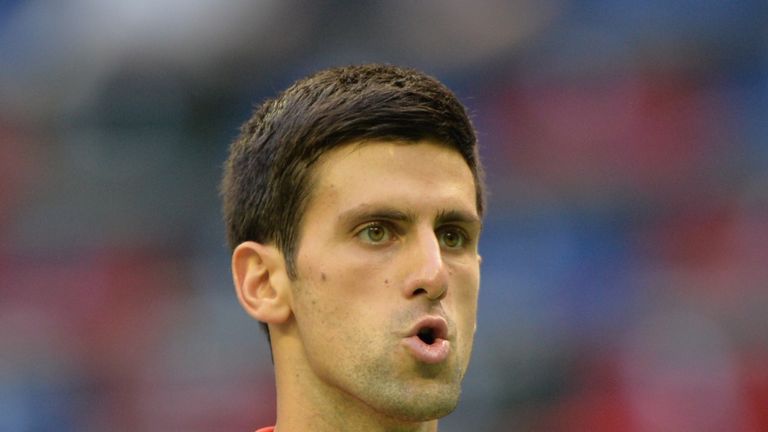 Novak Djokovic of Serbia reacts after a point against Marcel Granollers of Spain