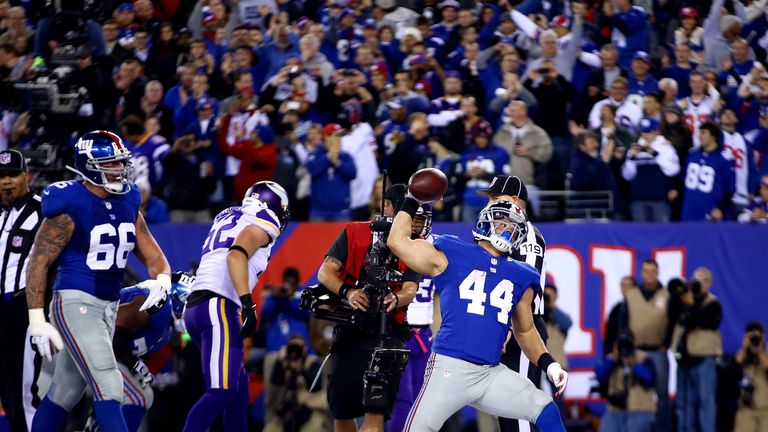 Running back Peyton Hillis #44 of the New York Giants celebrates a touchdown in the third quarter against the Minnesota Vikings during a game at MetLife Stadium on October 21, 2013 in East Rutherford, New Jersey. 