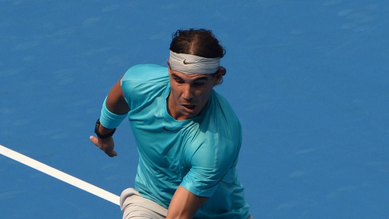 Rafael Nadal of Spain hits a return against Fabio Fognini of Italy during his men's singles quarter-final match at the China Open tennis tournament in Beijing on October 4, 2013.
