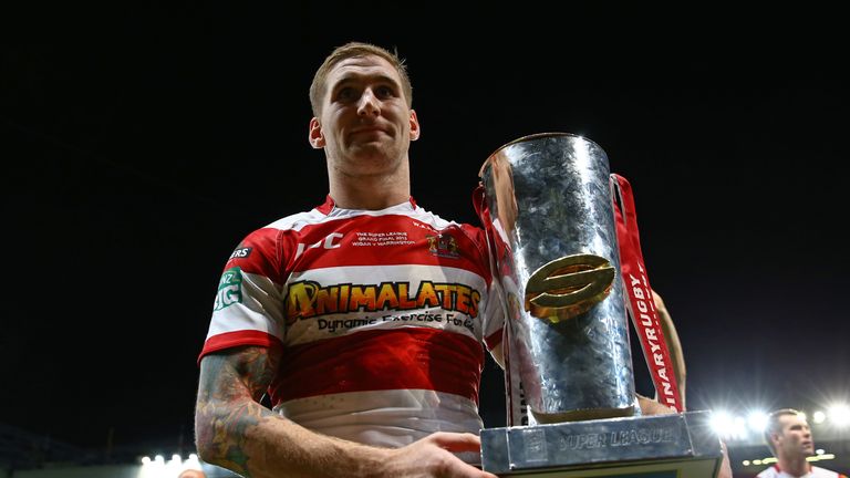 Sam Tomkins of Wigan celebrates with the trophy following his team's 30-16 victory during the Super League Grand Final against Warrington Wolves