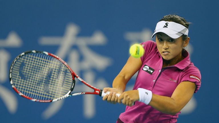 Misaki Doi of Japan returns a shot to Sara Errani of Italy during day three of the 2013 China Open at the National Tennis Center on September 30, 2013 in Beijing, China