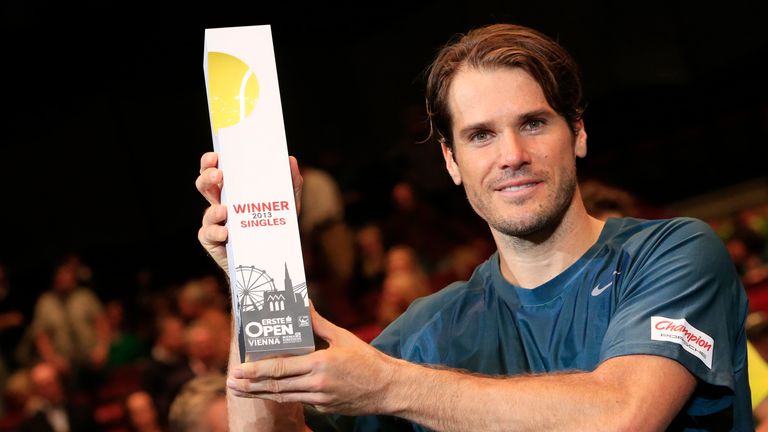 Germany's Tommy Haas poses with the Erste Bank Open trophy after beating Robin Haase in the final